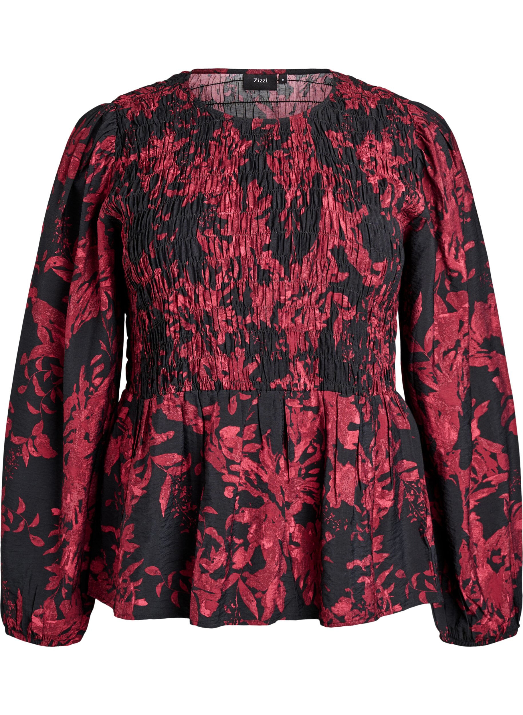 Pusero smokkiosalla ja pitkill&auml; hihoilla