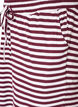 Raidalliset pyjamahousut korkealla vy&ouml;t&auml;r&ouml;ll&auml; ja leveill&auml; lahkeilla, Punainen, Packshot image number 2