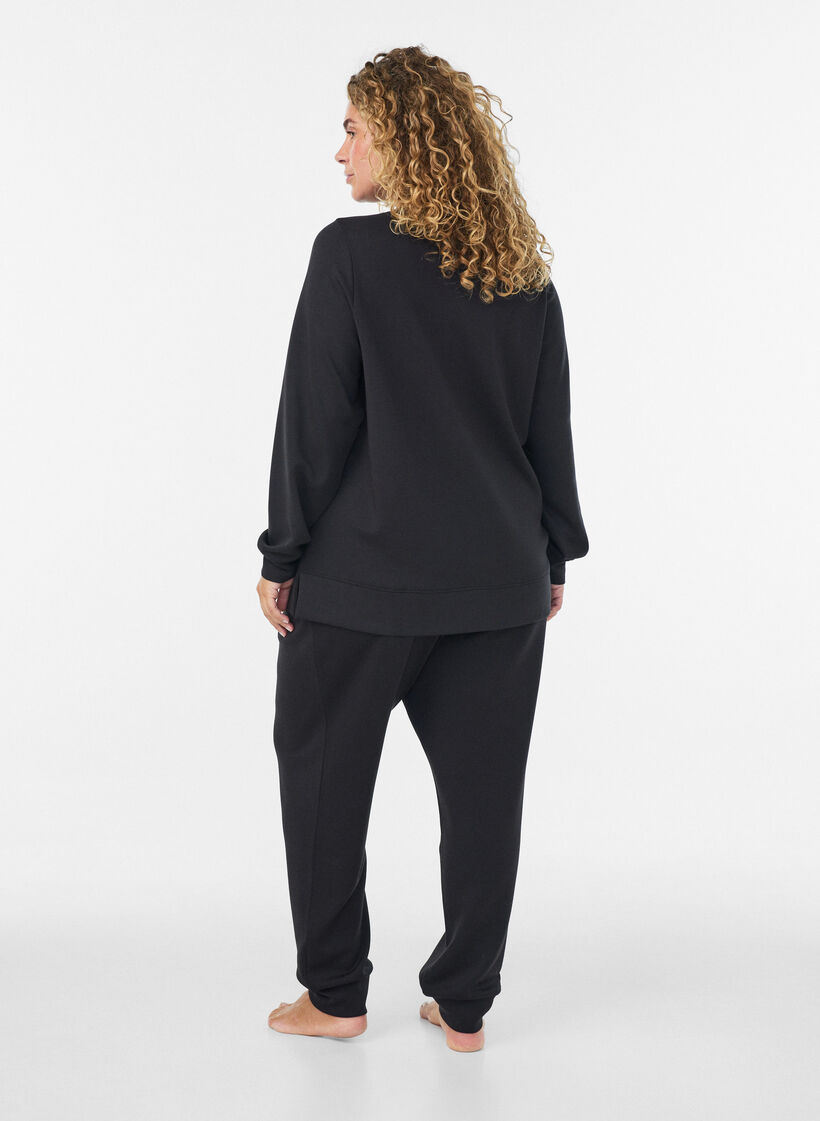 Pitk&auml;hihainen jerseypusero py&ouml;re&auml;ll&auml; p&auml;&auml;ntiell&auml;, Musta, Model image number 2