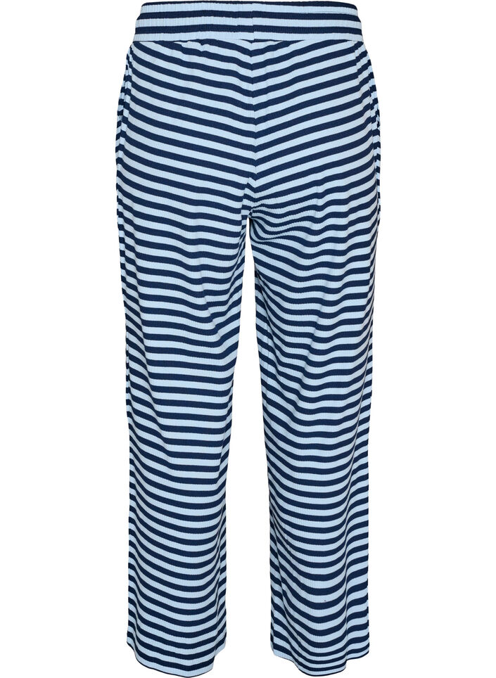 Raidalliset pyjamahousut korkealla vy&ouml;t&auml;r&ouml;ll&auml; ja leveill&auml; lahkeilla, Sininen, Packshot image number 1