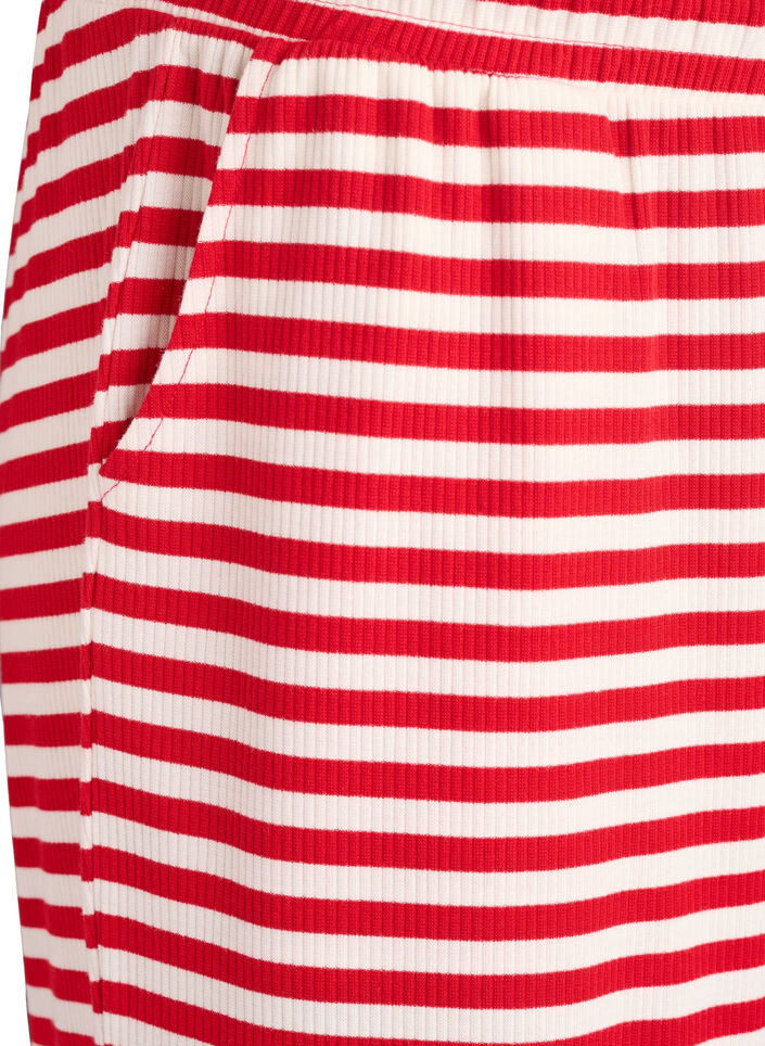 Raidalliset pyjamahousut korkealla vy&ouml;t&auml;r&ouml;ll&auml; ja leveill&auml; lahkeilla, Punainen, Packshot image number 2
