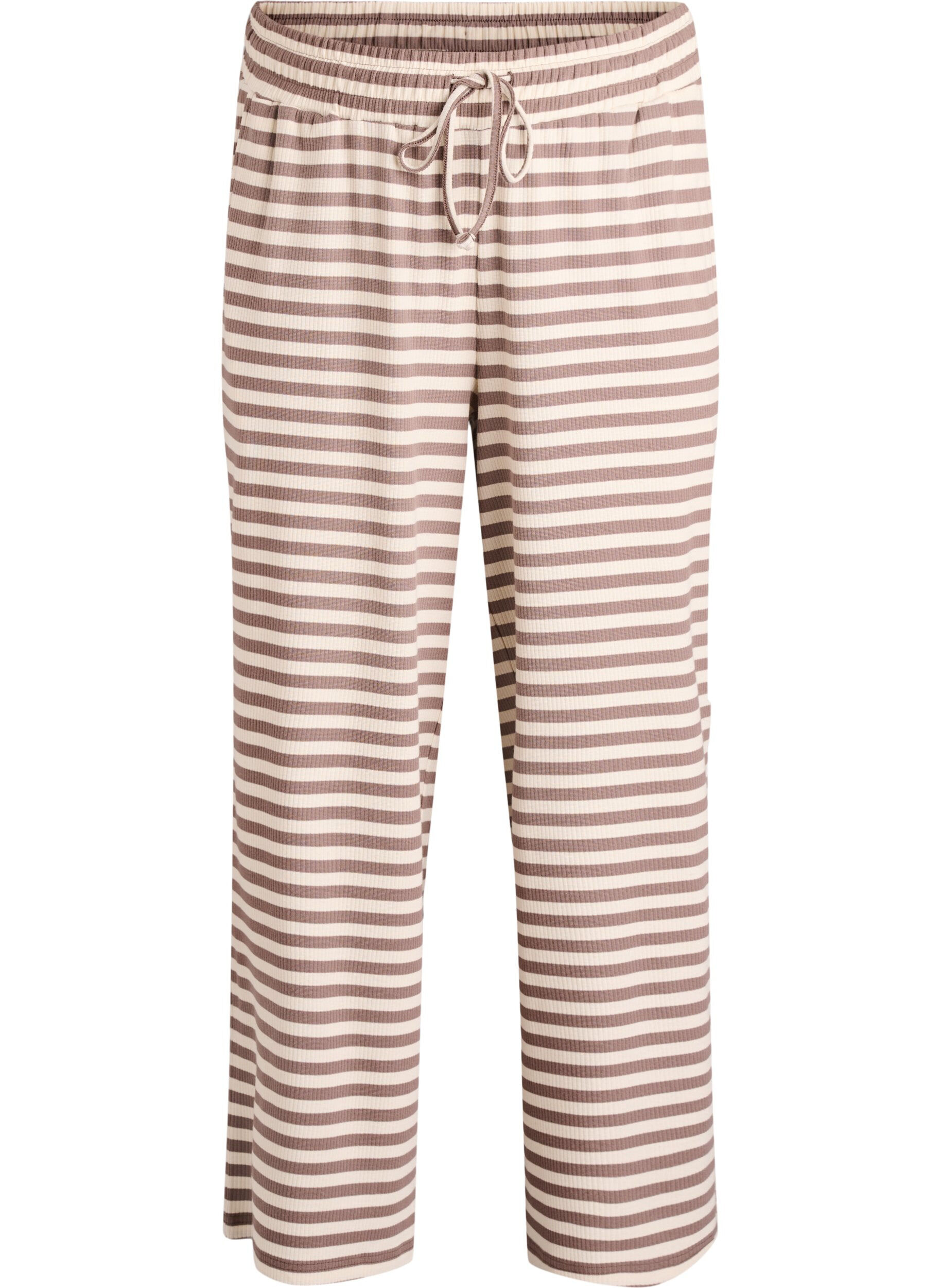 Raidalliset pyjamahousut korkealla vy&ouml;t&auml;r&ouml;ll&auml; ja leveill&auml; lahkeilla