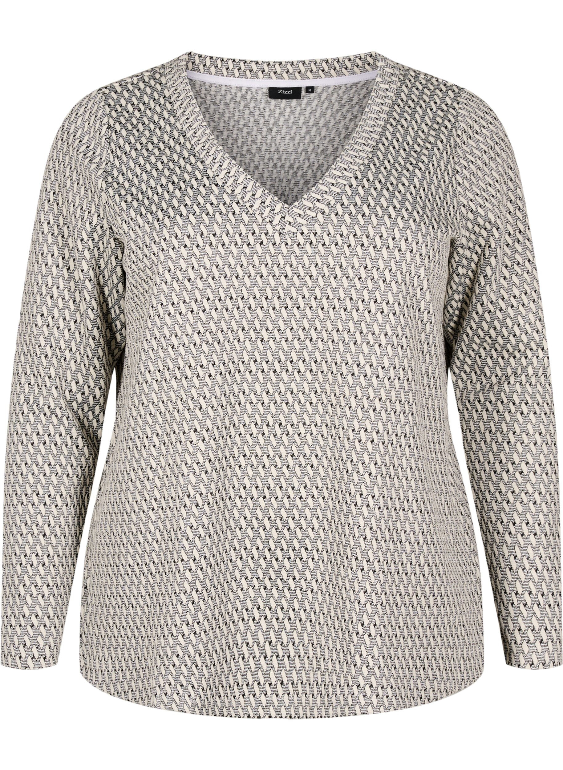 Pusero kuvioidulla tekstuurilla ja kimallelangalla