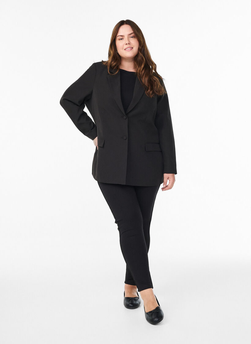 Leggingsit glitterraidoilla ja halkioilla, Musta, Model image number 1