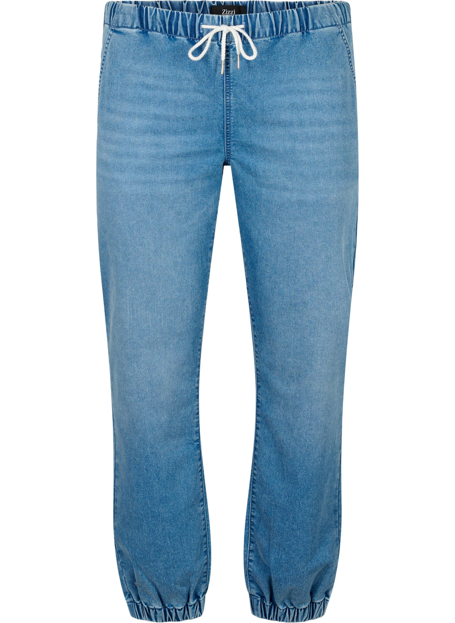 Denimhousut taskuilla