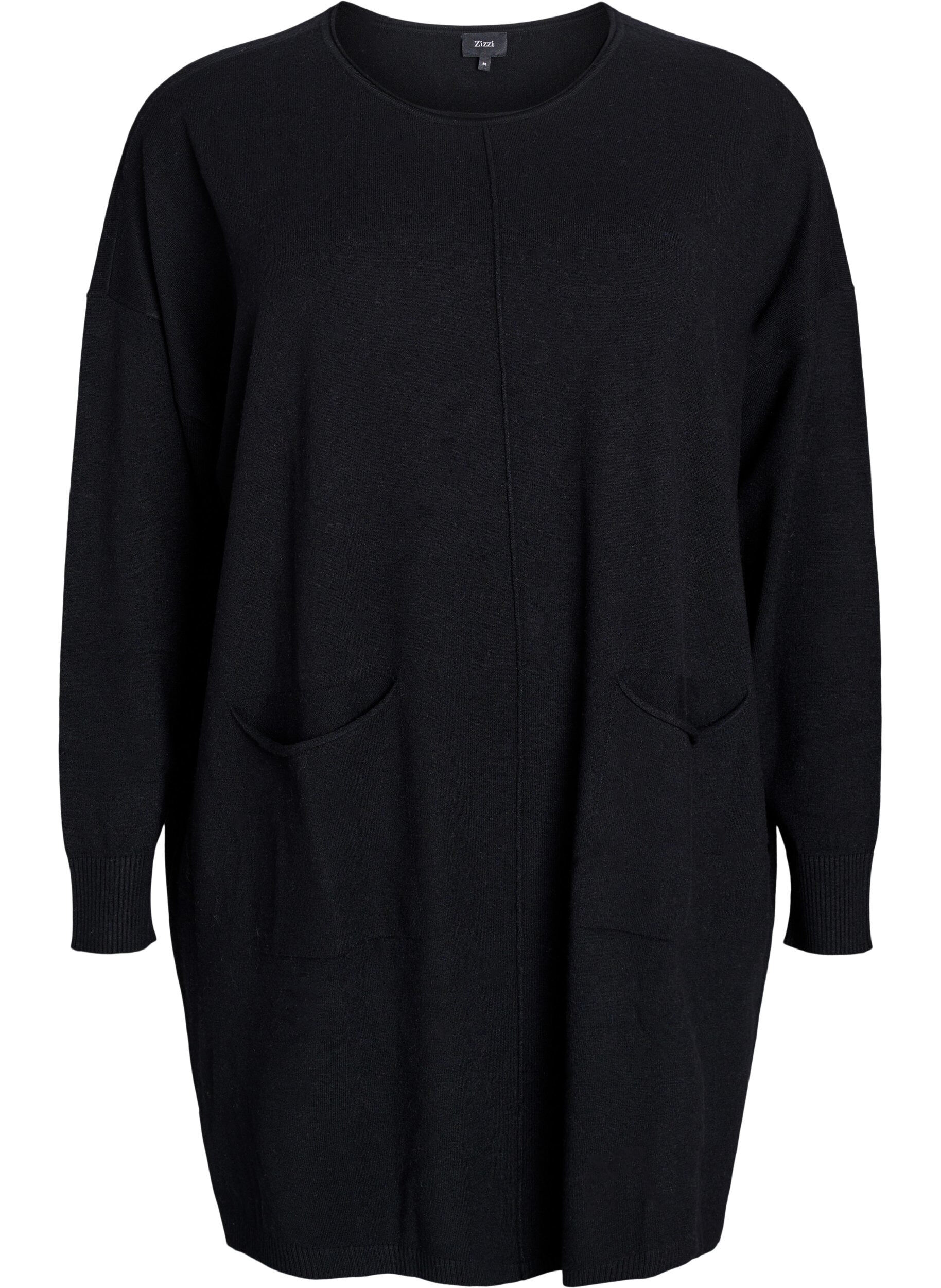 Lyhyt neulemekko, jossa keskitikki ja taskut