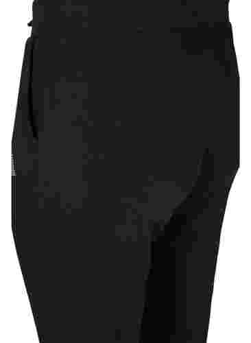 Yksiväriset treenihousut taskuilla, Black, Packshot image number 3