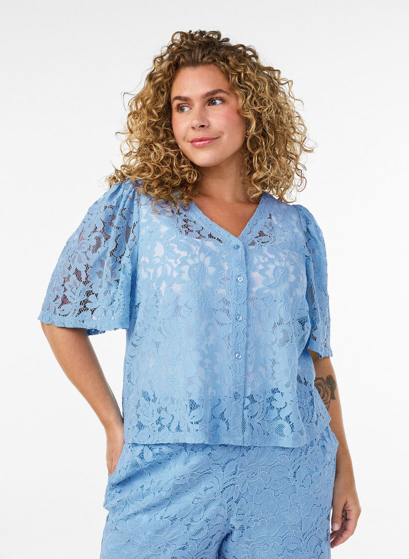 Pitsishortsit korkealla vy&ouml;t&auml;r&ouml;ll&auml; ja taskuilla, Sininen, Model image number 0