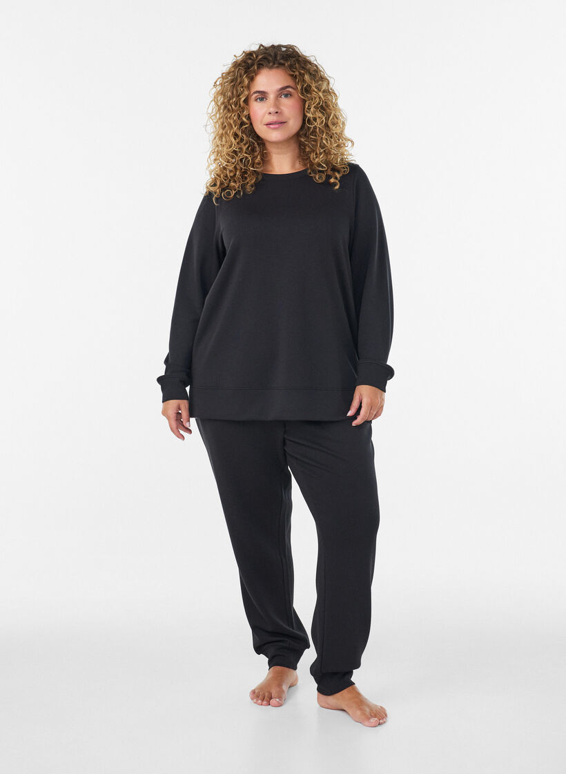Pitk&auml;hihainen jerseypusero py&ouml;re&auml;ll&auml; p&auml;&auml;ntiell&auml;, Musta, Model image number 1