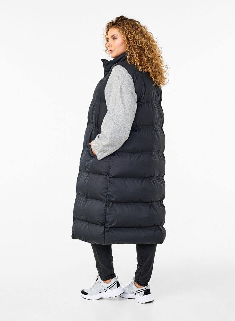 Pitk&auml; liivi, jossa on taskut ja kaksisuuntainen vetoketju, Musta, Model image number 1