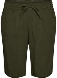 V&auml;lj&auml;sti istuvat puuvillamusliinishortsit korkealla vy&ouml;t&auml;r&ouml;ll&auml;, Vihre&auml;