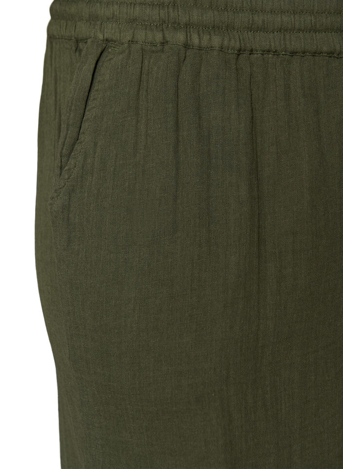 V&auml;lj&auml;sti istuvat puuvillamusliinishortsit korkealla vy&ouml;t&auml;r&ouml;ll&auml;, Vihre&auml;, Packshot image number 3