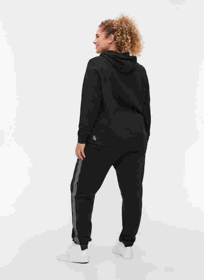 Collegehousut nyörillä ja taskuilla , Black, Model image number 1