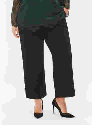 Kropatut housut leveillä lahkeilla, Black, Model image number 2