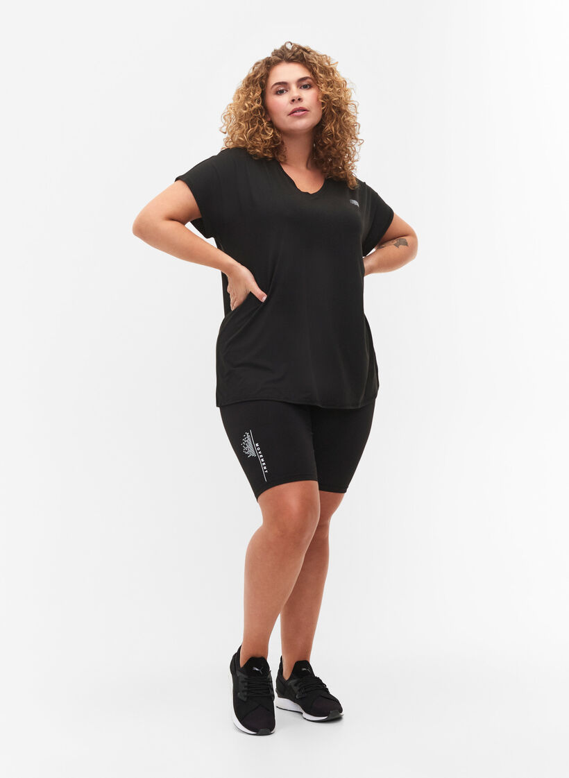 Tyköistuvat treenishortsit logolla, Black, Model image number 2