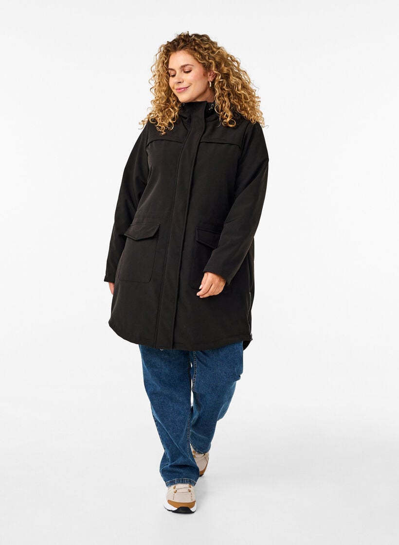 Vett&auml; hylkiv&auml; softshell-takki, jossa on tikattu vuori, Musta, Model image number 1
