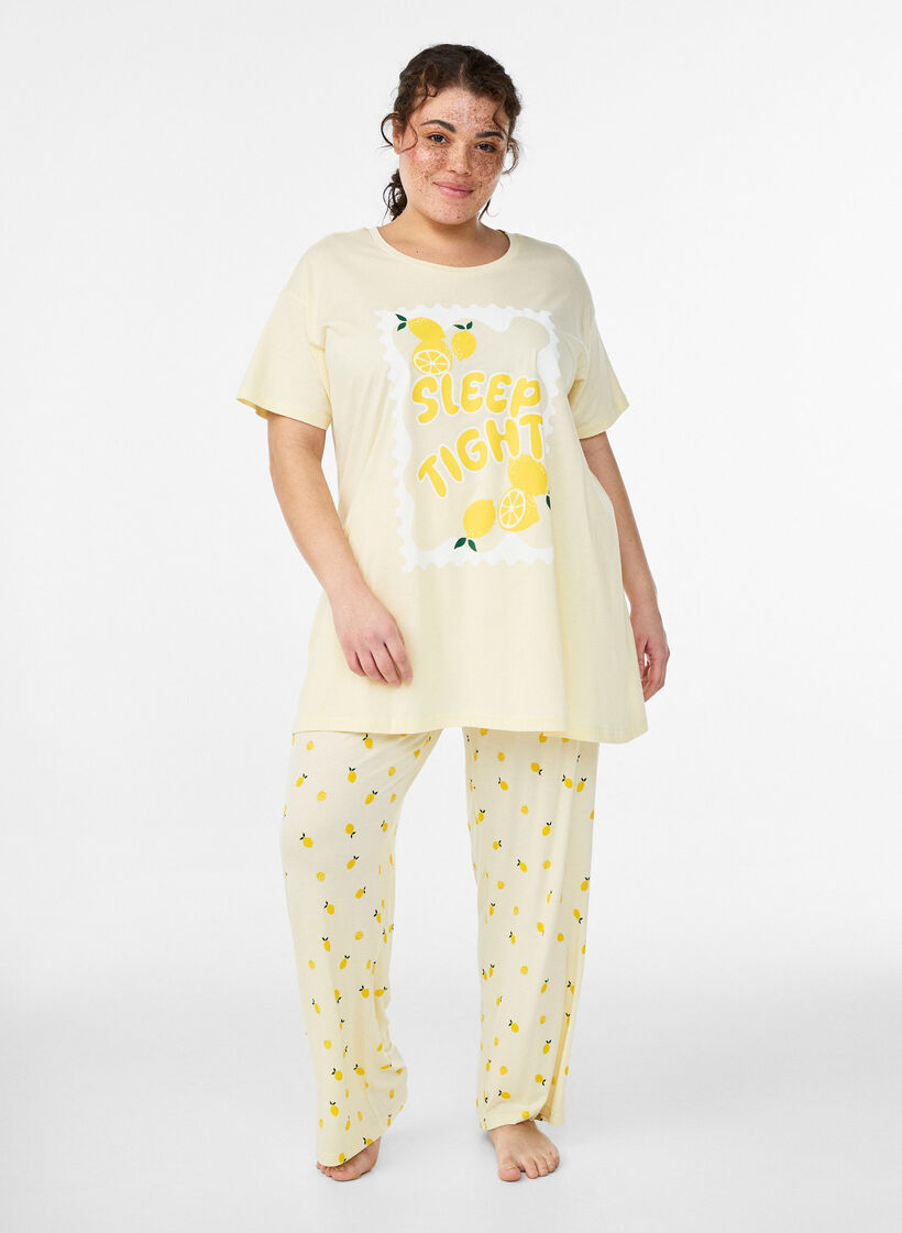 Pyjamahousut pehme&auml;st&auml; jersey-materiaalista, korkea vy&ouml;t&auml;r&ouml; ja hedelm&auml;kuosi, Keltainen, Model image number 0