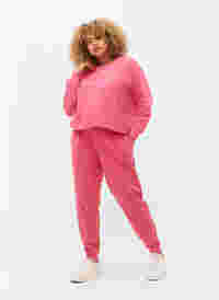 Collegehousut printillä ja taskuilla , Hot Pink AOP, Model