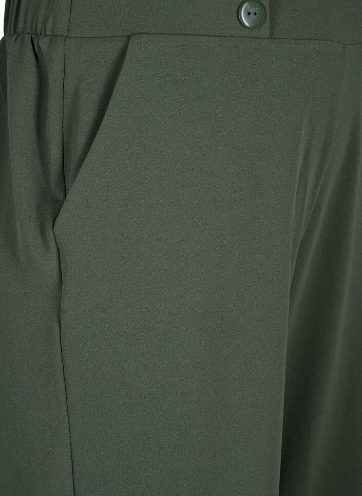 7/8-pituiset housut v&auml;lj&auml;ll&auml; istuvuudella, Vihre&auml;, Packshot image number 2