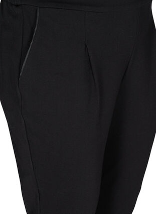 Nilkkapituiset ja yksiväriset housut , Black, Packshot image number 2