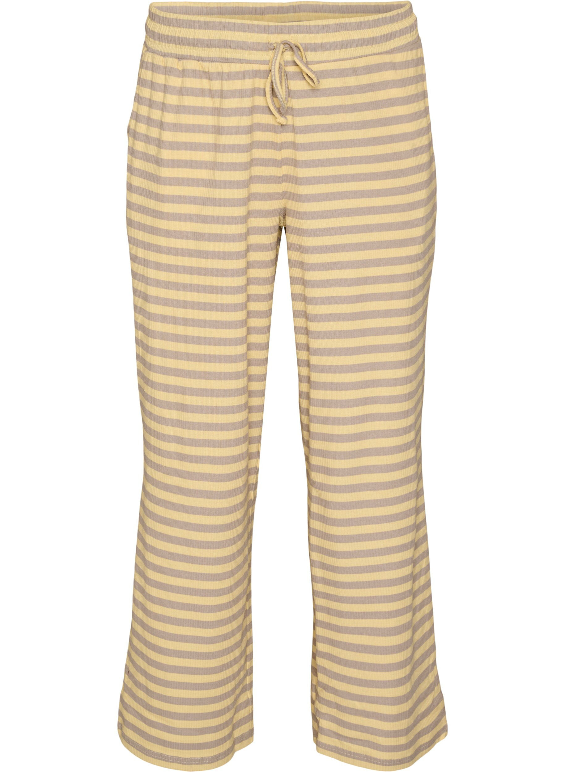 Raidalliset pyjamahousut korkealla vy&ouml;t&auml;r&ouml;ll&auml; ja leveill&auml; lahkeilla